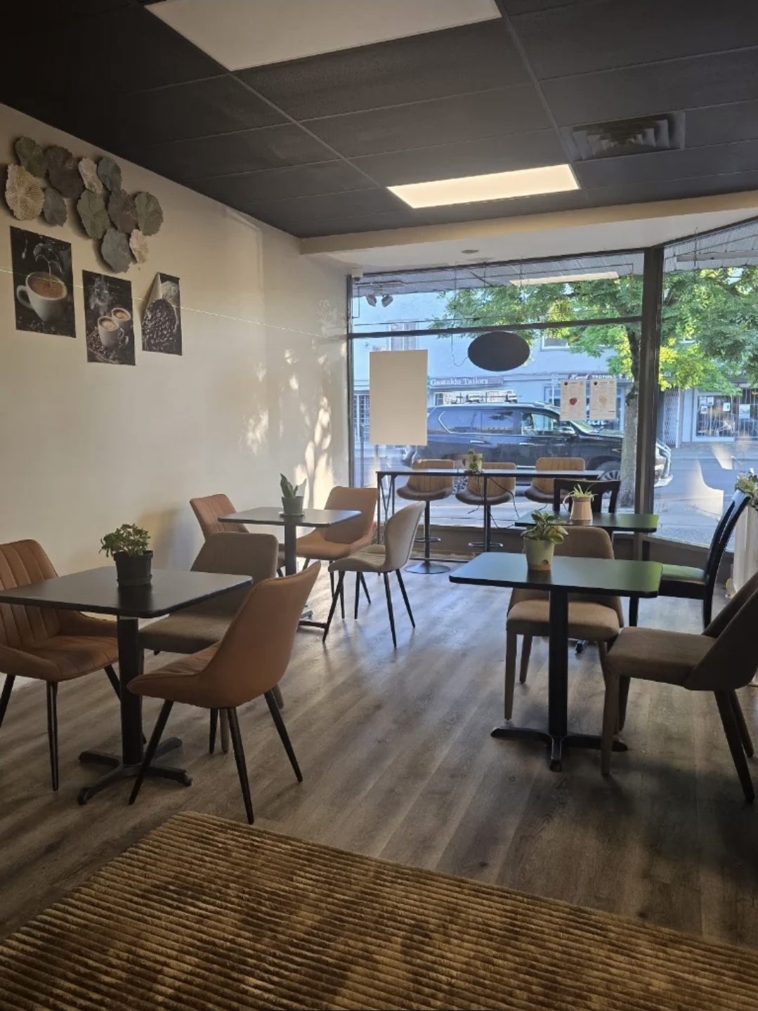 Tables by the front window at You N Me' Café